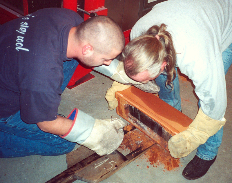 hot glass casting_removing glass from the mold for annealing